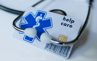 A medical id card attached to a stethoscope by Marek Studzinski courtesy of Unsplash.