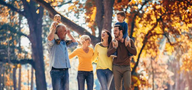 Multl-Generation Family in Autumn Park Having Fun