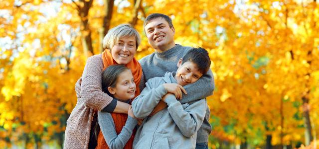 Happy Family Having Fun in Autumn City Park